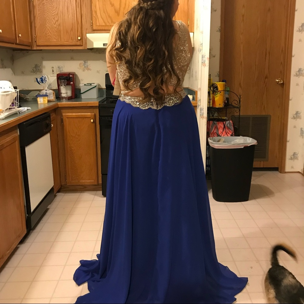 The dress is one of a kind with hand sewn beads